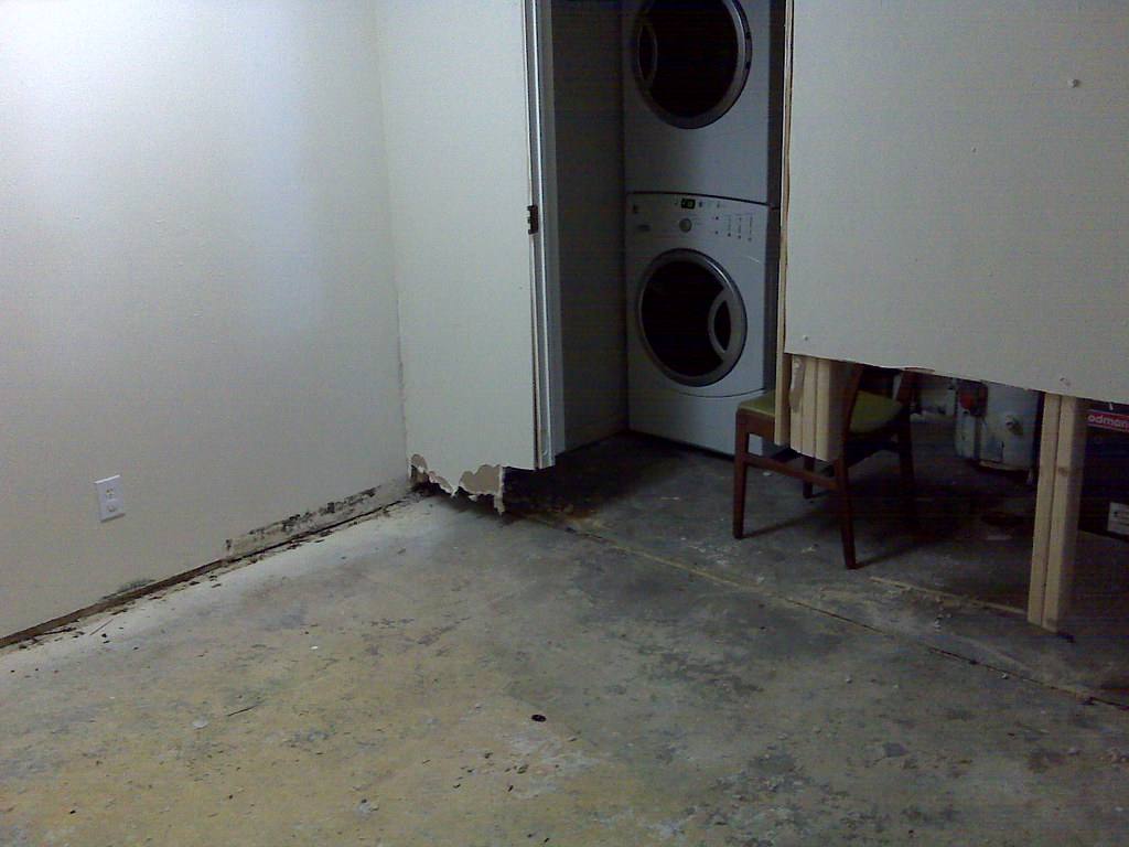 Room with wet drywall cut away and flooring removed during water damage cleanup in Gardena, CA 90247