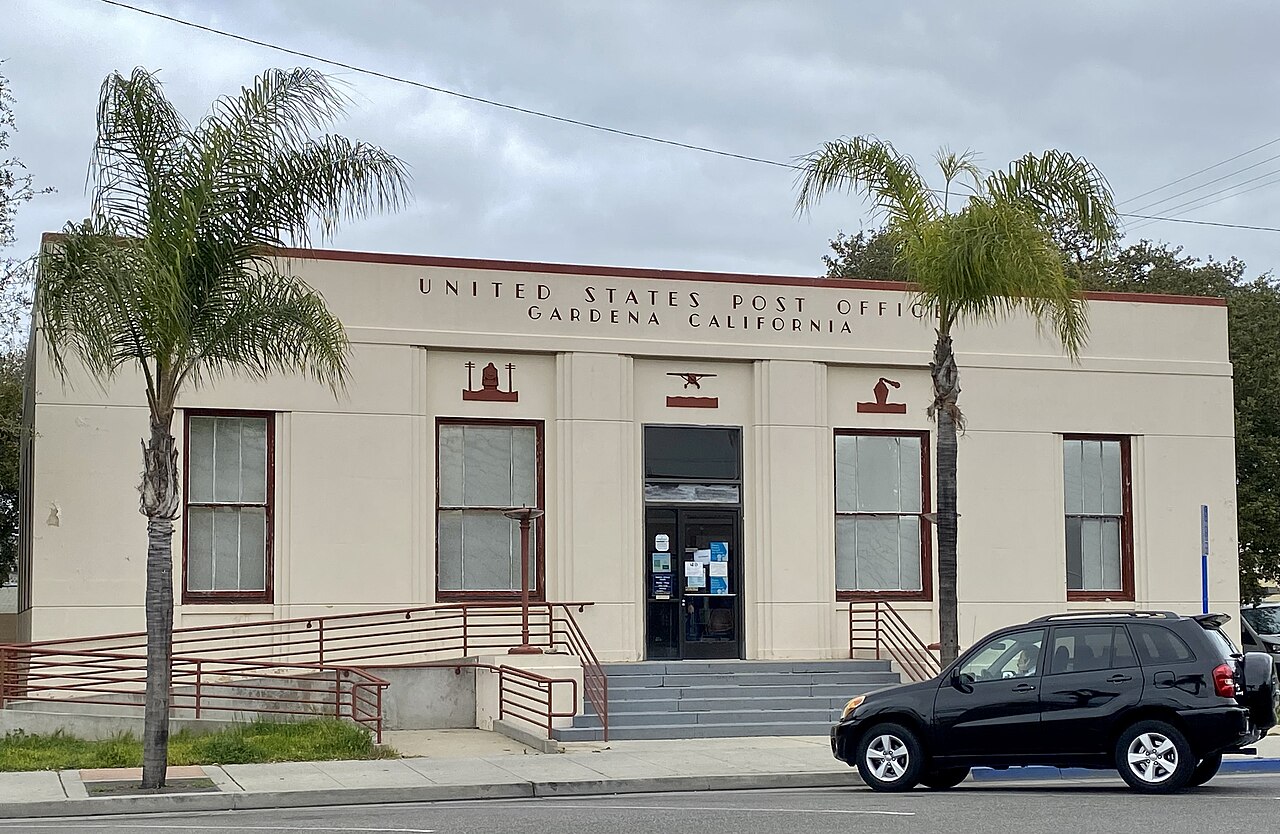 Front of the 1939 Art Deco post office with palm trees on Gardena Boulevard in Gardena, CA 90247